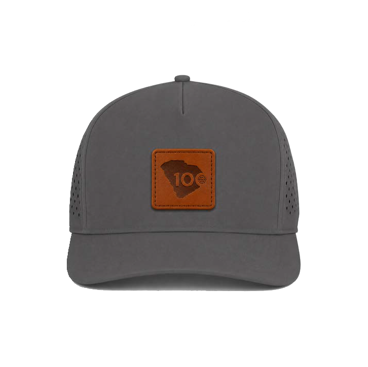 A dark gray trucker-style cap with a brown leather patch on the front.