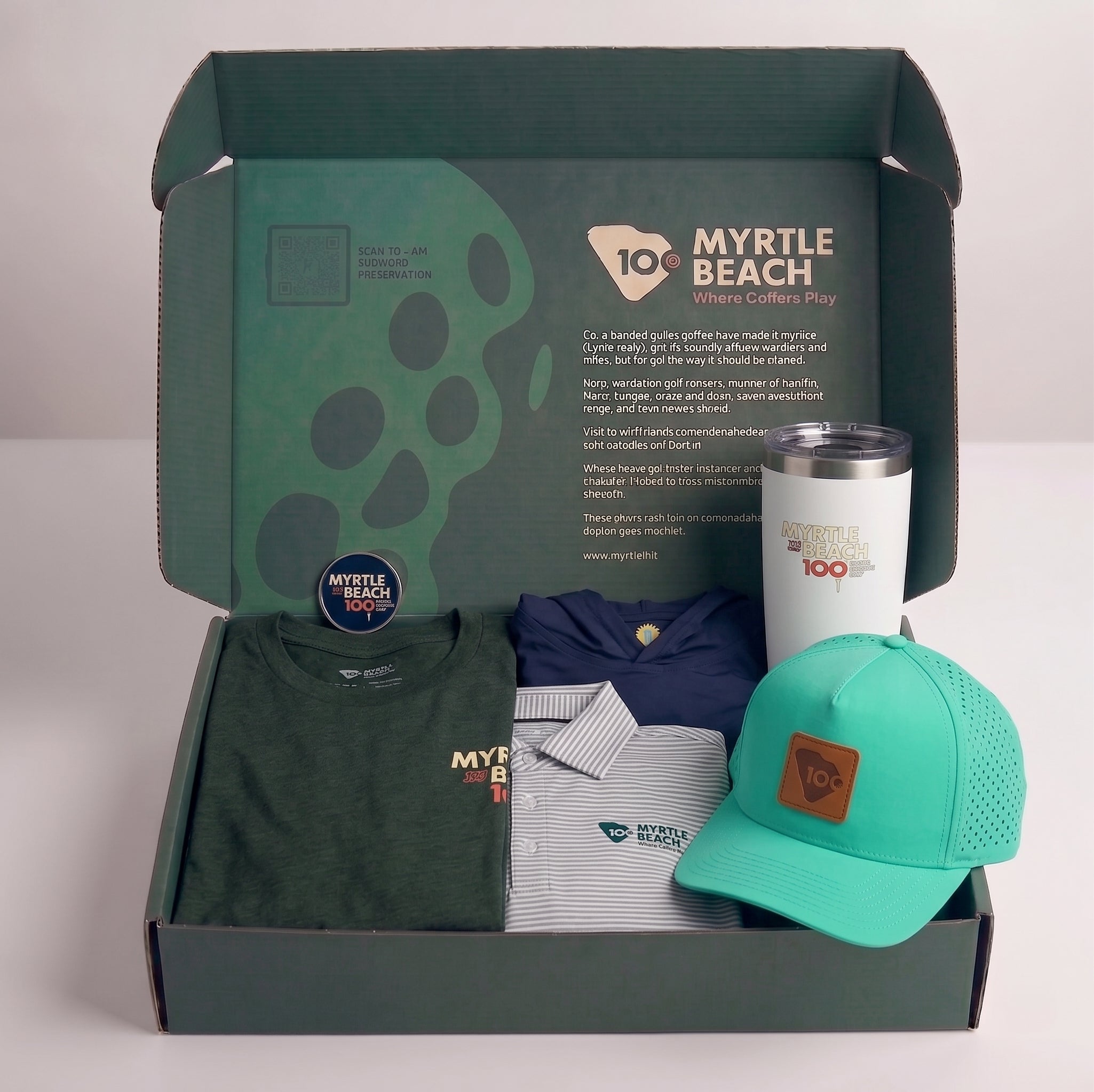 A curated gift box set from Myrtle Beach Collers Play, featuring a dark green t-shirt, a striped polo shirt, a navy polo, a bright teal baseball cap, and a white insulated tumbler, all arranged inside an open branded box.
