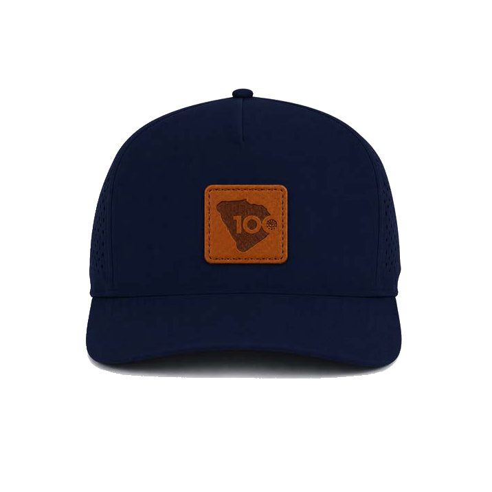 A navy blue baseball cap with a brown leather patch on the front.