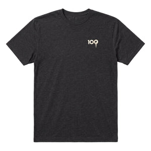 A dark heather black crewneck t-shirt with a small beige graphic on the left chest reading '100', displayed flat against a light gray background.